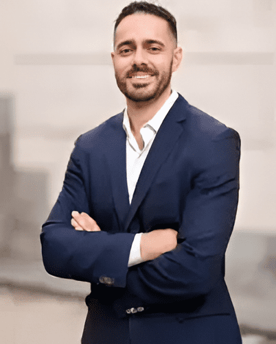 LAOSS Sports Medicine Specialist Dr. Hayk Stepanyan smiles and folds arms