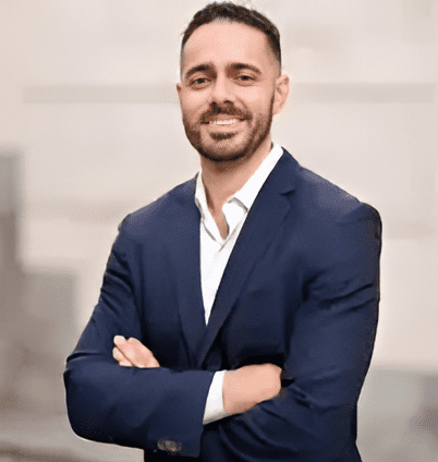 LAOSS Sports Medicine Specialist Dr. Hayk Stepanyan smiles and folds arms